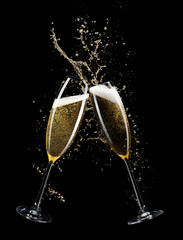 two glasses of champagne isolated on black background © Iurii Kachkovskyi