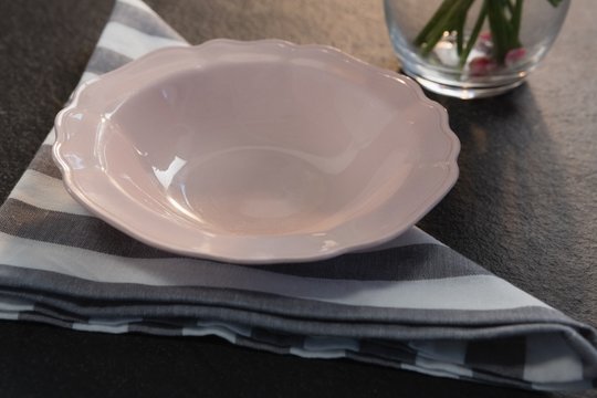 Pink bowl on folded napkin