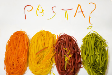 funny colored paste. Food. Italian cheerful cuisine. are you hungry? colored spaghetti on white background