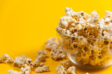 Pop corn in a vase on yellow background. Minimalist