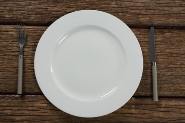 Plate and cutlery set on a table 