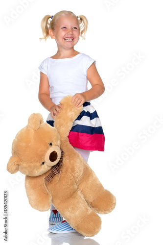 little girl with a teddy bear