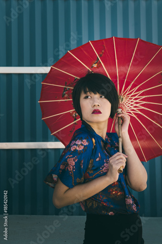 Portrait Of A Stylish Fashion Young Chinese Woman With A