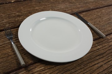 Plate and cutlery set on a table 