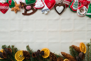 Easy Christmas craft for adult or kids to make. Felt heart, rocking horse, christmas tree on yellow table. Sewing craft concept. DIY ideas for winter holiday. Flat lay style.