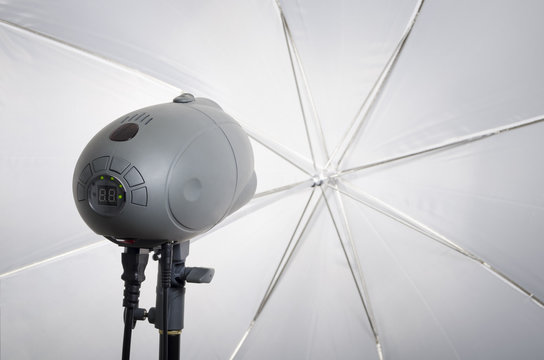 Professional photography studio flash light with reflecting umbrella