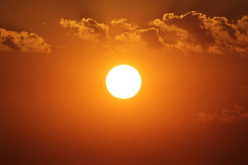 big bright sun on sky background