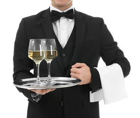 Waiter holding tray with glasses of wine on white background