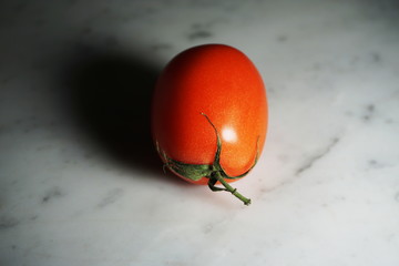 Isolated Tomato on White Marble Background