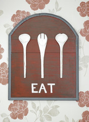 old red wooden background and white eat word