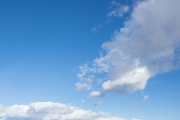 Naklejka na ściany i meble Blue sky background with clounds