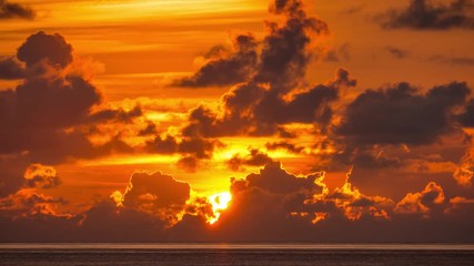 Dramatic beautiful sunrise over ocean. 4K UHD Timelapse.