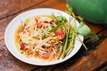 Thai food Papaya salad Spicy flavor On the old wood table
