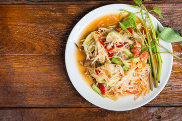 Thai food Papaya salad Spicy flavor On the old wood table