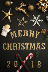 Fototapeta na wymiar Christmas holiday background with gold ornaments and decorations. Merry christmas and happy new year greeting card with copy space. Christmas celebration holiday background.