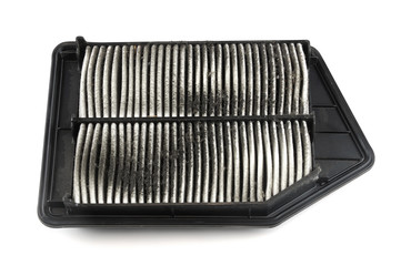 Close up on dirty air filter isolated on white background