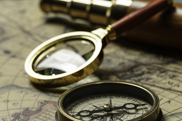 Fototapeta premium Retro compass with old map and spyglass