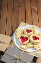 Cookies in the shape of hearts and gifts Valentine's day, top view, free space for text