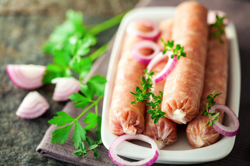 Kupaty - raw shashlik sausage of pork barbecue, grill. Raw sausage for grill.  Picnic. Selective focus.