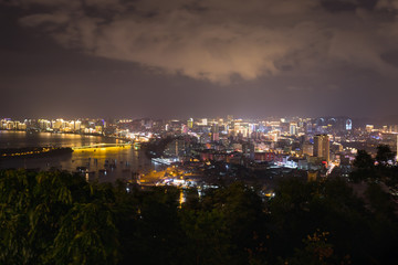 Fototapeta na wymiar Night city of Sanya on Hainan Island, view from the park Deer turned Head or Lu Hui Tou Gong Yuan