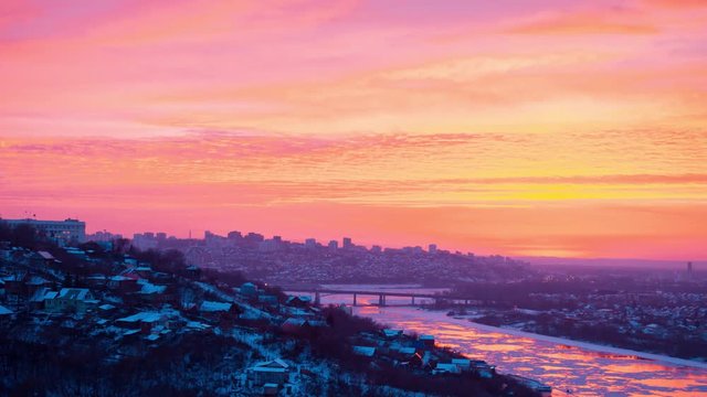 Timelapse of dramatic beautiful sunrise over the panorama of the city of Ufa at winter