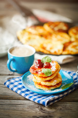 Delicious pancakes on wooden table with Cup of coffee and jam