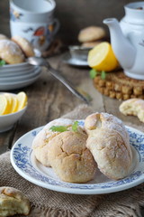Lemon cookies with powdered sugar on a plate