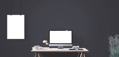 Computer display and office tools on desk.