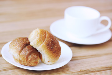 Homemade croissant . Delicious fresh croissant on wood table.