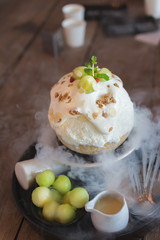 Bingsu with Smoke on Wooden Table.