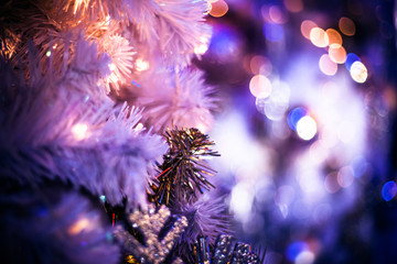 Obraz na płótnie Canvas Abstract background at night winter with closeup christmas tree.