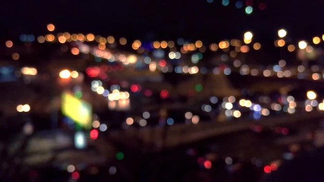Defused night city lights with moving cars. Bokeh and blur city noise. Huge night road HD footage.