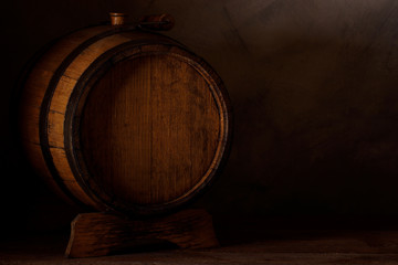 a small wooden wine bar, barrel on the legs and a wooden crane on a wooden background