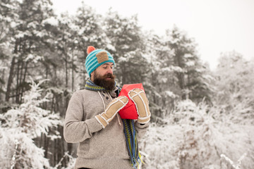 Fototapeta na wymiar Bearded man in santa hat at new year.