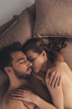 beautiful sexy young naked couple sleeping together in bed foto de Stock |  Adobe Stock