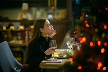 Woman enjoy wine in restaurant