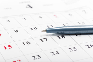 Check out the dates in a business calendar concept