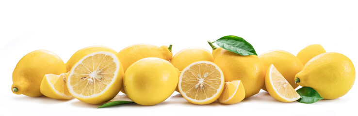 Lot of lemon fruits with lemon leaves isolated. Horizontal photo.