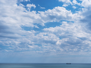 Calm sea and cloudy sky. Nature background.