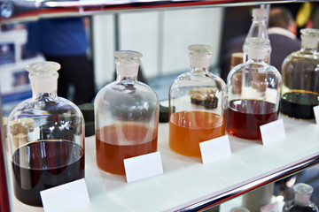 Chemical fluids on shelf in industrial laboratory