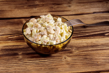 Salad with white kidney beans, potatoes, chicken meat, eggs and mayonnaise
