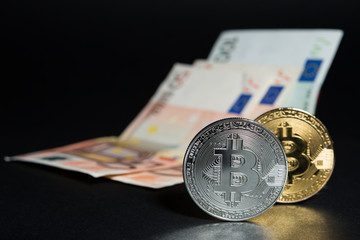 Bitcoins and euro banknotes money