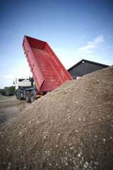 Excavator moving sand and gravel 