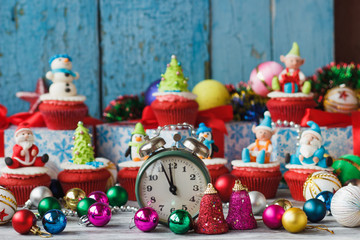 Christmas cupcakes with colored decorations made from confectionery mastic