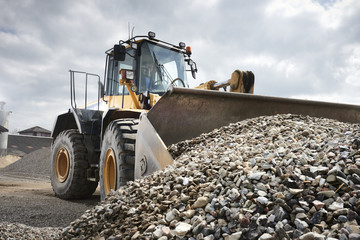 Excavator moving sand © PickOne
