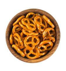 pretzels in a wooden bowl isolated on white