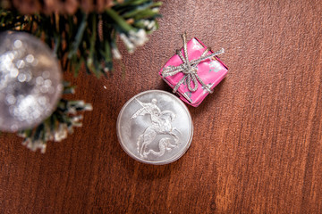 Silver coin three rubles - St. George Shoots the Dragon. Toys and decorative box on the Christmas tree