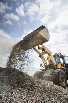 Excavator moving sand
