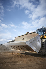 Excavator moving sand