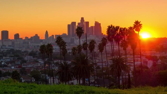 Sunset to night zoom out from city of Los Angeles downtown skyline